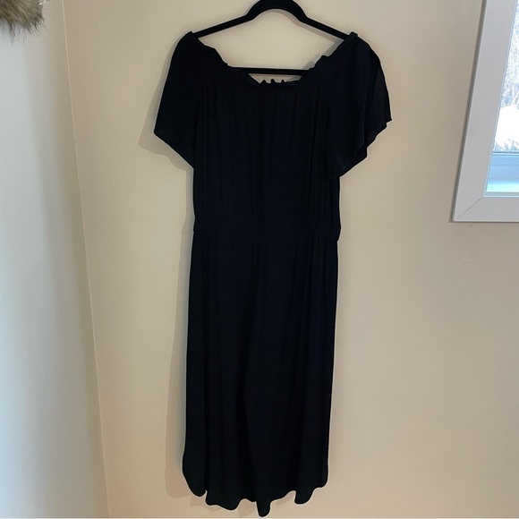 Melissa Nepton black off shoulder jumpsuit with flutter sleeves and tulip legs. - Picture 2 of 9